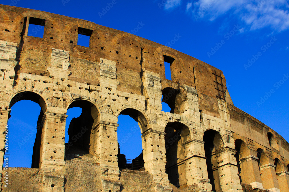 colosseum wall in Rome with blue sky
