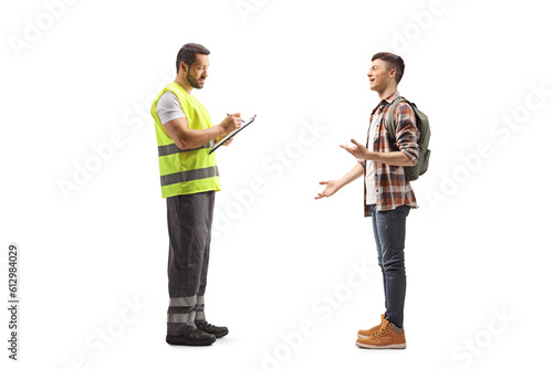 Full length shot of a male student talking to a man in a reflective vest
