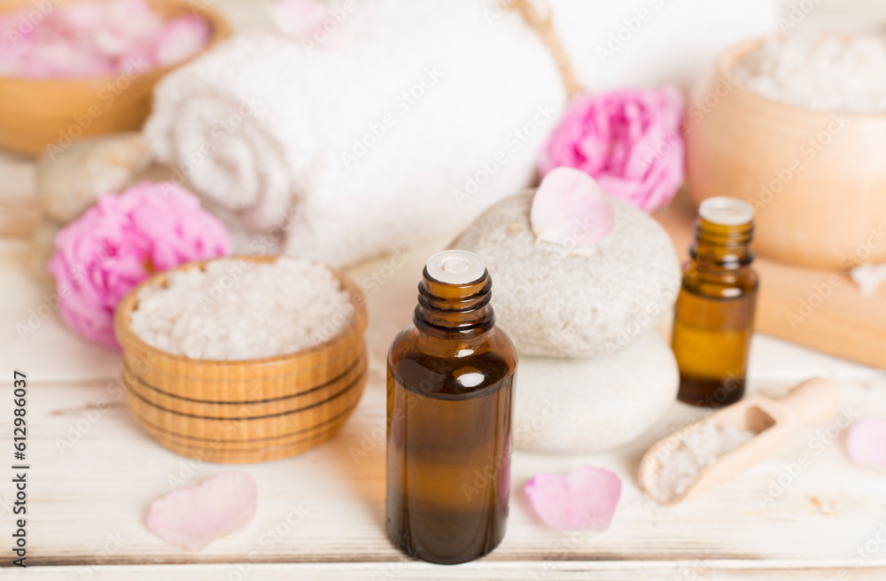 Spa composition with pink roses on wooden table Spa composition with pink roses on wooden table