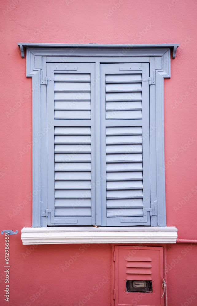 Antique window with a gray shutter in Plaka, Greece. Antique window with a gray shutter in Plaka, Greece.