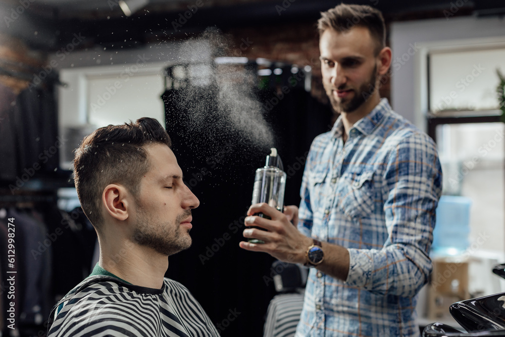 Work in the barber shop. Man hairstylist Work in the barber shop. Man hairstylist