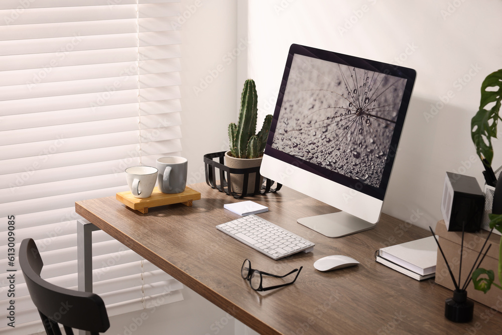 Fototapeta premium Cozy workspace with computer on wooden desk at home