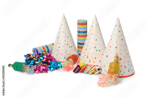 Party crackers and different festive items on white background