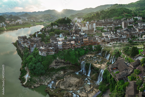 Beautiful ancient town in China with waterfall and traditional houses photo