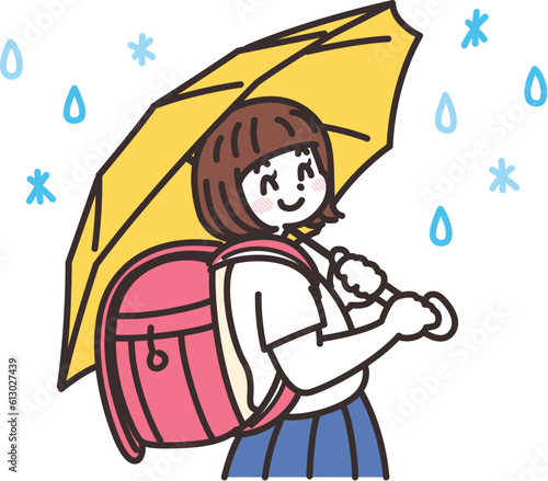 雨の日に傘を差す女子小学生