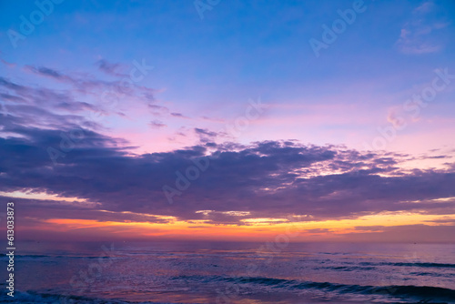 The landscape of the sunrise is brilliantly bright over the colorful sea  with the sky and the brilliant clouds. Sea style sunrise and sunset.