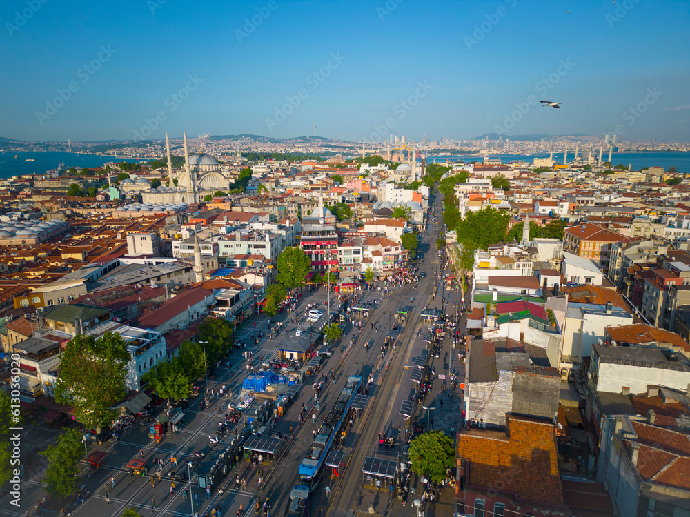 Yeniceriler Caddesi Street and Grand Bazaar aerial view with Nuruosmaniye Mosque, Blue Mosque and Hagia Sofia, Golden Horn at the background in historic city of Istanbul, Turkey.  