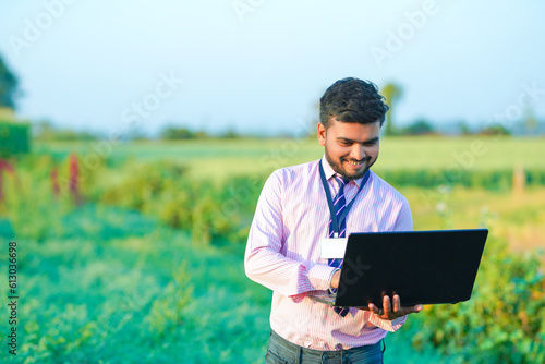 Indian Banker (agronomist) with farm field  © Pratik Patil
