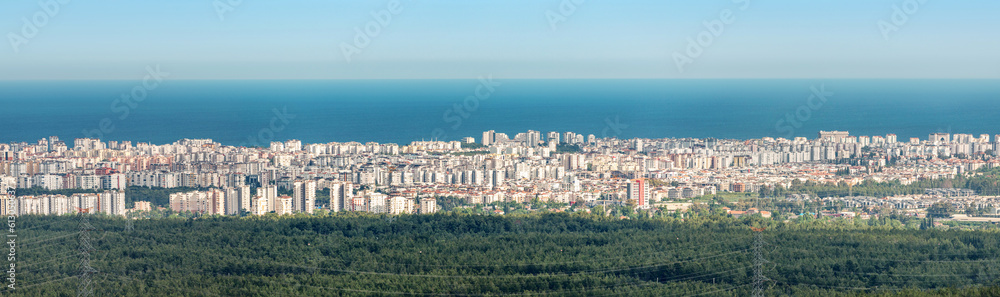 Panoramic cityscape view of Antalya resort town and mediterranean sea in the background