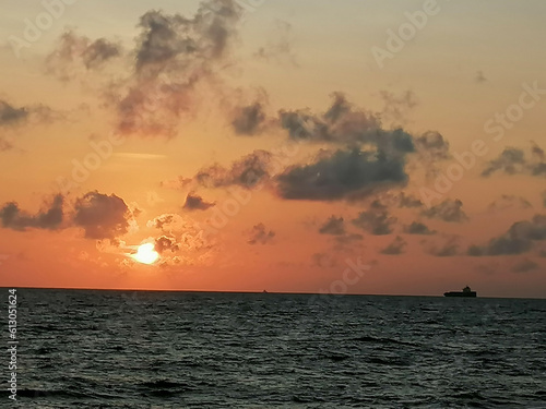 sunset over the sea © Tharindu