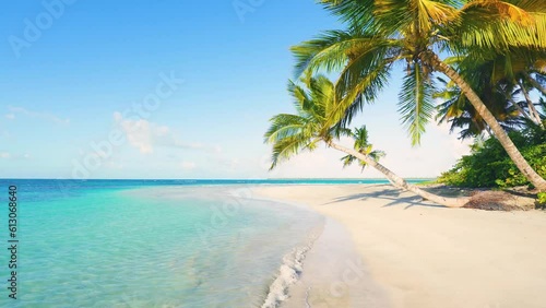 Thailand tropical beach with palms and turquoise sea. Palms, sea, waves and sky. Phuket natural summer tourism concept. Clean sandy beach of Thailand coast on a sunny summer day. Video is toned.