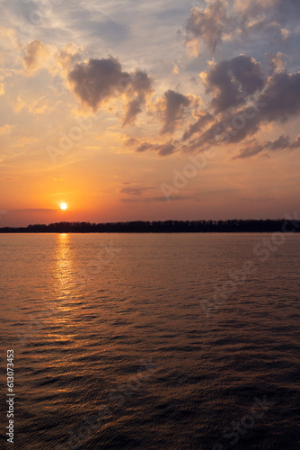 A stunning sunset view over a river © karandaev