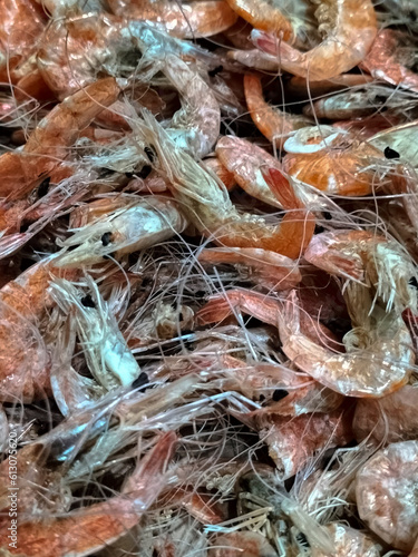 Selective focus. Dried shrimps throughout the screen. Image of seafood. 