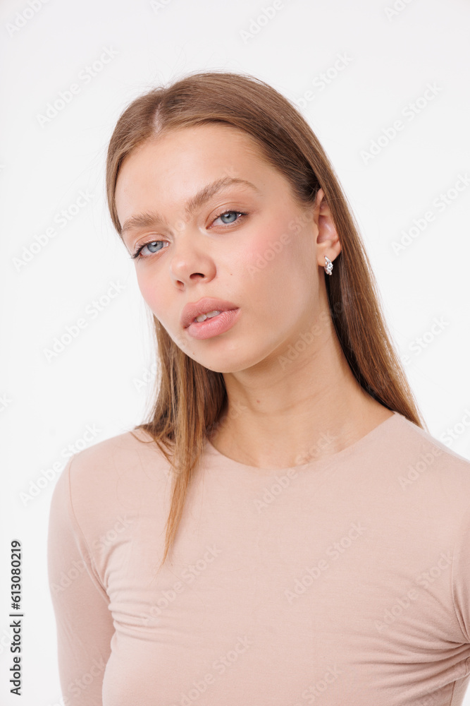 Beautiful young girl with fresh healthy skin. Woman advertise ear-rings. White background. Earrings closeup. Blond european woman with long hair with big lips, pretty smile. Cosmetology, scincare Beautiful young girl with fresh healthy skin. Woman advertise ear-rings. White background. Earrings closeup. Blond european woman with long hair with big lips, pretty smile. Cosmetology, scincare