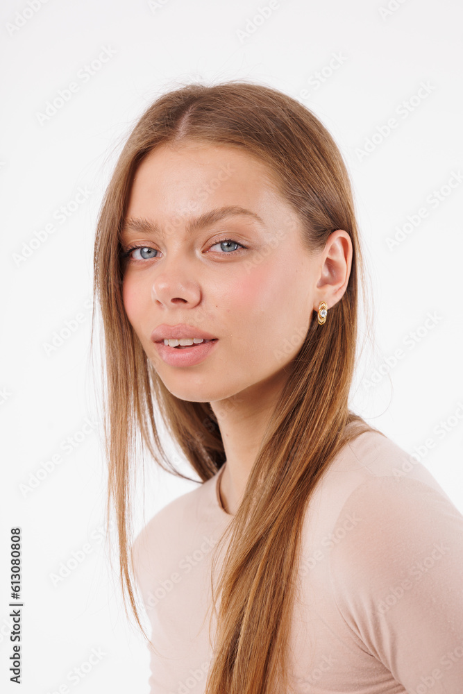 Beautiful young girl with fresh healthy skin. Woman advertise ear-rings. White background. Earrings closeup. Blond european woman with long hair with big lips, pretty smile. Cosmetology, scincare Beautiful young girl with fresh healthy skin. Woman advertise ear-rings. White background. Earrings closeup. Blond european woman with long hair with big lips, pretty smile. Cosmetology, scincare