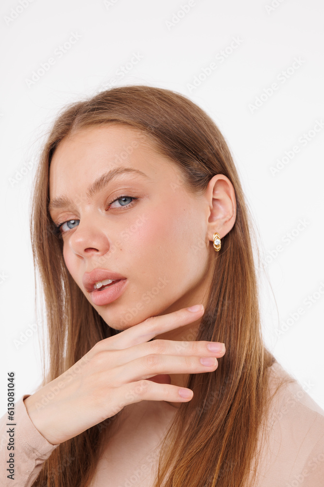 Beautiful young girl with fresh healthy skin. Woman advertise ear-rings. White background. Earrings closeup. Blond european woman with long hair with big lips, pretty smile. Cosmetology, scincare Beautiful young girl with fresh healthy skin. Woman advertise ear-rings. White background. Earrings closeup. Blond european woman with long hair with big lips, pretty smile. Cosmetology, scincare