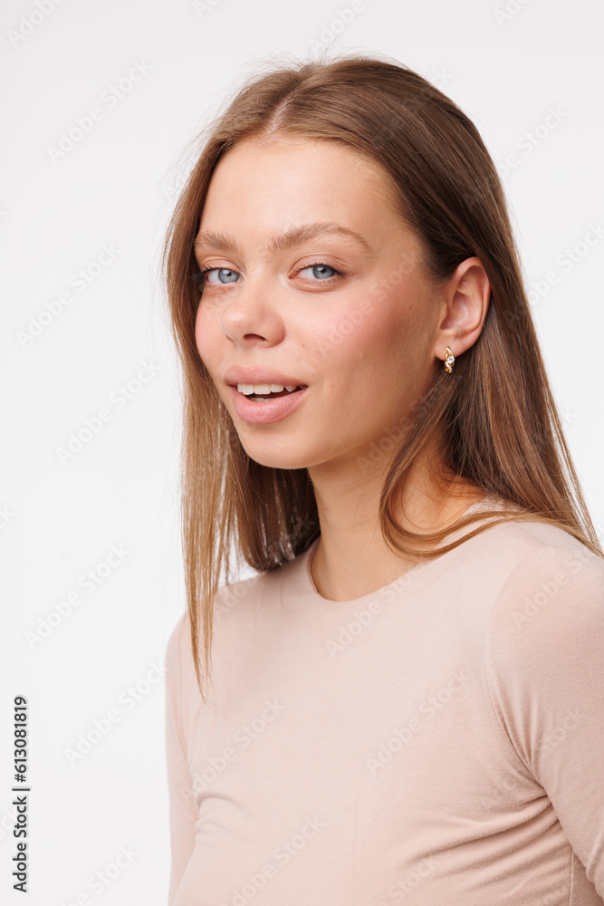 Beautiful young girl with fresh healthy skin. Woman advertise ear-rings. White background. Earrings closeup. Blond european woman with long hair with big lips, pretty smile. Cosmetology, scincare Beautiful young girl with fresh healthy skin. Woman advertise ear-rings. White background. Earrings closeup. Blond european woman with long hair with big lips, pretty smile. Cosmetology, scincare