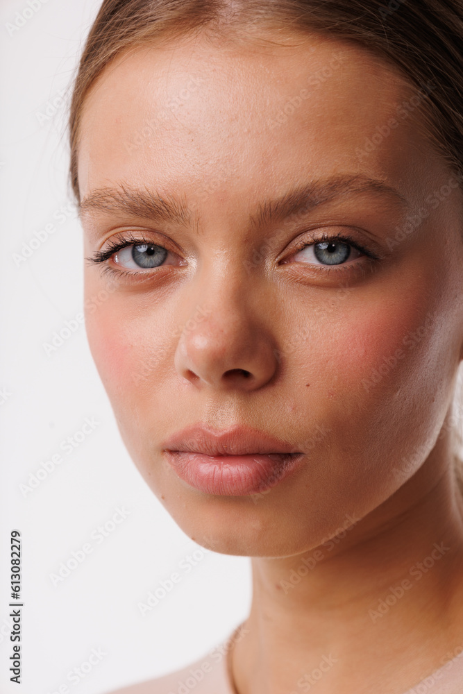 Beautiful young girl with fresh healthy skin. Woman advertise ear-rings. White background. Earrings closeup. Blond european woman with long hair with big lips, pretty smile. Cosmetology, scincare Beautiful young girl with fresh healthy skin. Woman advertise ear-rings. White background. Earrings closeup. Blond european woman with long hair with big lips, pretty smile. Cosmetology, scincare