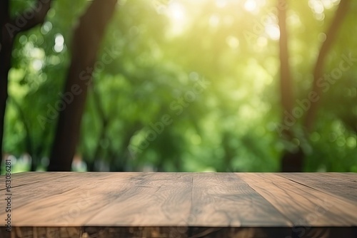 Tabletop with open space. Empty wooden table on abstract blur natural green forest background