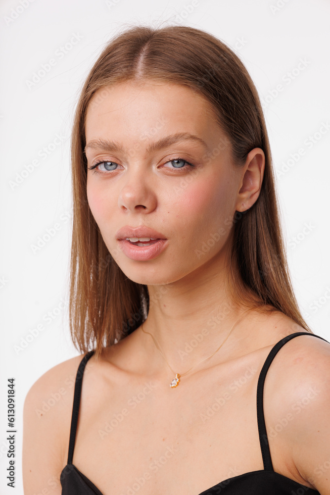 Beautiful young girl with fresh healthy skin. Woman advertise ear-rings. White background. Earrings closeup. Blond european woman with long hair with big lips, pretty smile. Cosmetology, scincare Beautiful young girl with fresh healthy skin. Woman advertise ear-rings. White background. Earrings closeup. Blond european woman with long hair with big lips, pretty smile. Cosmetology, scincare