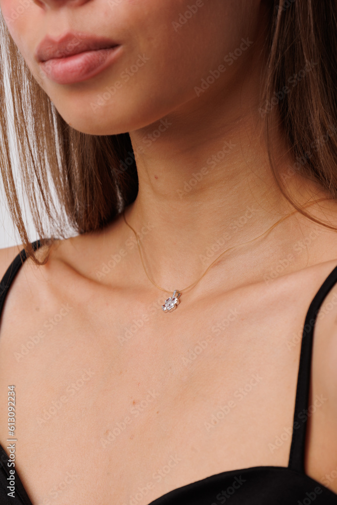 Beautiful young girl with fresh healthy skin. Woman advertise ear-rings. White background. Earrings closeup. Blond european woman with long hair with big lips, pretty smile. Cosmetology, scincare Beautiful young girl with fresh healthy skin. Woman advertise ear-rings. White background. Earrings closeup. Blond european woman with long hair with big lips, pretty smile. Cosmetology, scincare