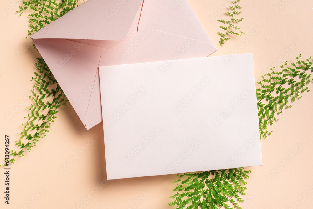 Blank greeting card and green leaves Blank greeting card and green leaves