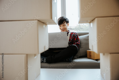 Asian young man starting a small business The seller prepares the delivery box for the customer. online sales or e-commerce