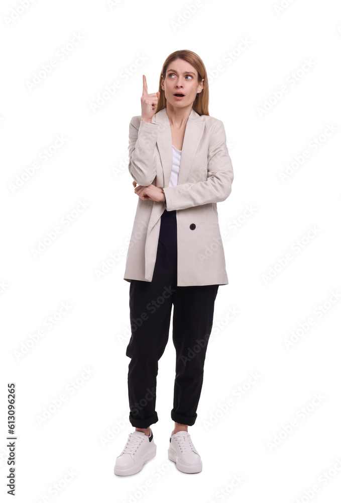 Beautiful business woman pointing at something on white background Beautiful business woman pointing at something on white background