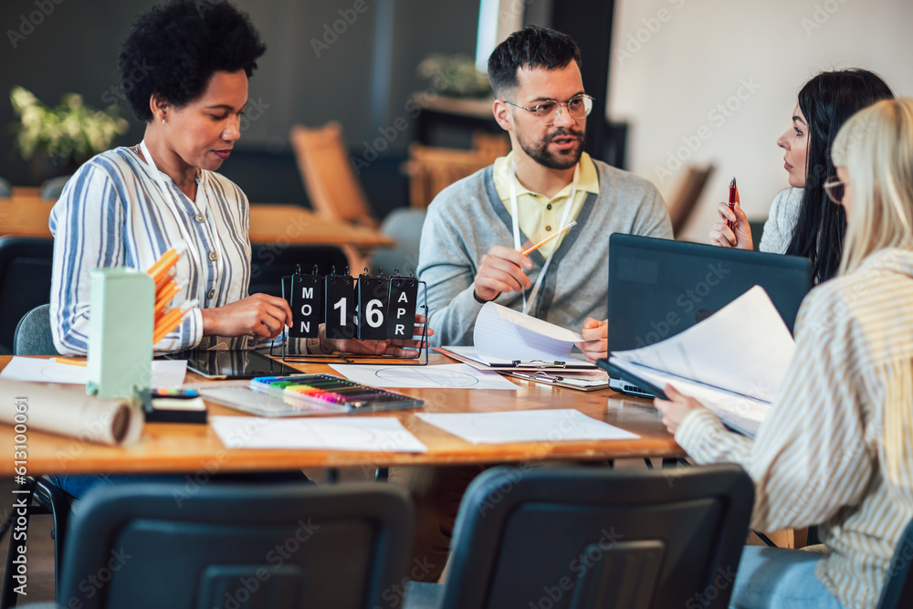 Modern business team discussing new ideas at the office. Business people on meeting in modern office. Modern business team discussing new ideas at the office. Business people on meeting in modern office.