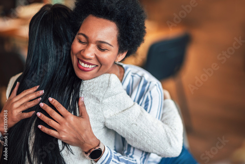 Фотография Support group patients hug each other during the therapy session.