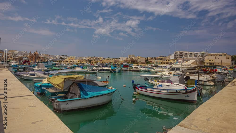 Port of small boats near beautiful Maltese township, time lapse view Port of small boats near beautiful Maltese township, time lapse view