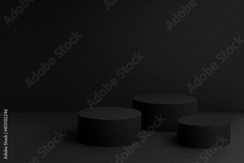 Abstract black stage with three round podiums mockup for presentation cosmetic products, goods, advertising, design, sale, text, display, showing, gradient in contemporary urban style, copy space.