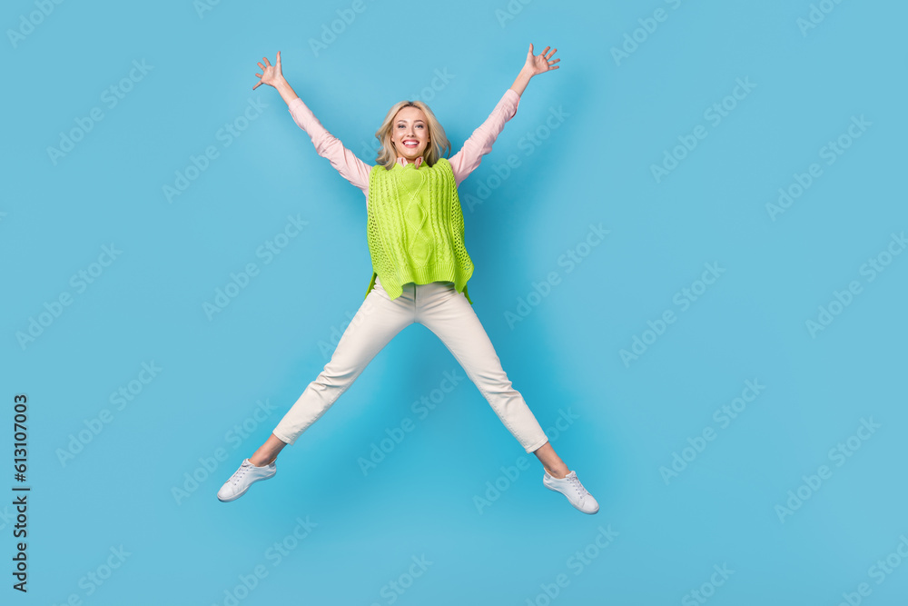 Full length portrait of overjoyed gorgeous person jumping make star figure isolated on blue color background