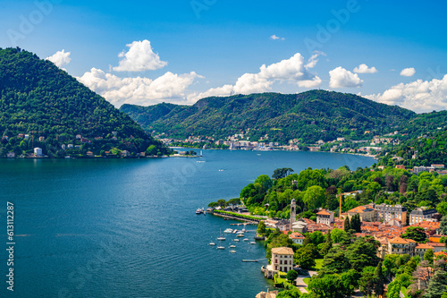 Panorama of Lake Como and the city of Como, the port and the mountains, from Cernobbio, on a summer day.
