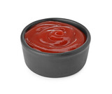 Bowl of tasty ketchup isolated on white. Tomato sauce