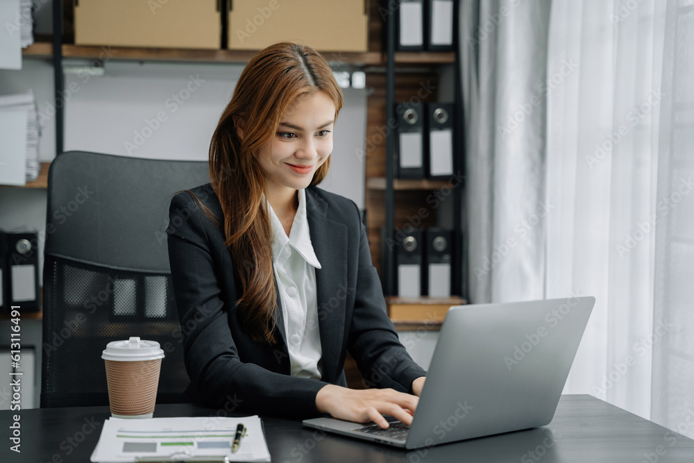 Business women hand working with tablet and laptop computer with documents on office desk in modern office. Business women hand working with tablet and laptop computer with documents on office desk in modern office.