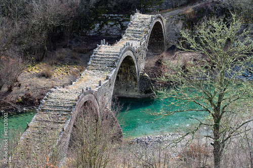 View of the traditional stone Kalogeriko or Plakida  Bridge in Zagori of Epirus, Greece in Autumn.
