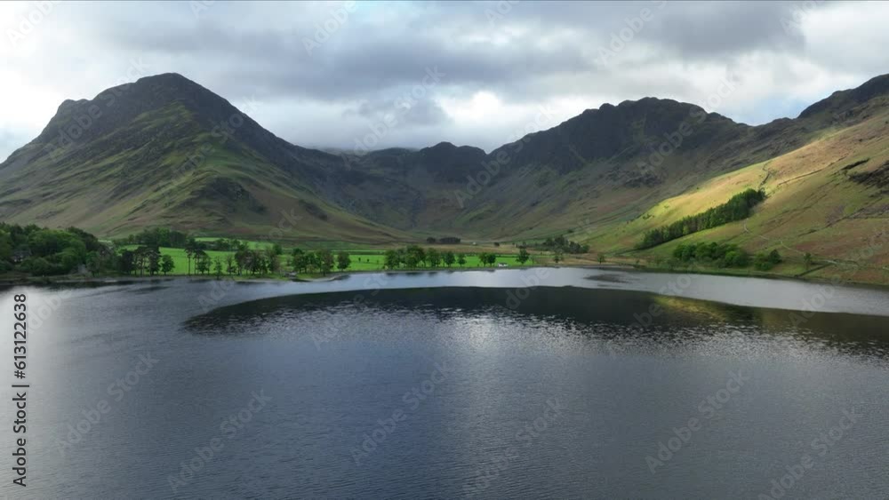 Aerial reveal of Buttermere lake on a spring morning, Cumbria. England. Aerial reveal of Buttermere lake on a spring morning, Cumbria. England.