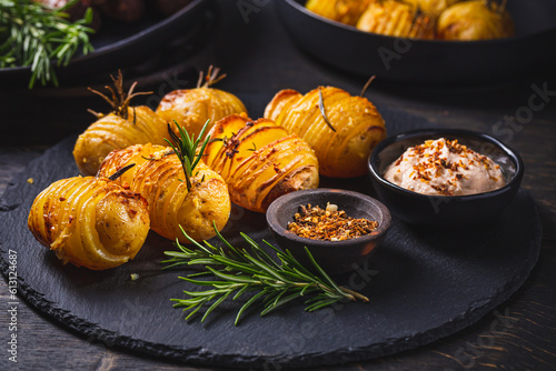 фотографія Hasselback potatoes with additional herbs, spices and whipped feta dip