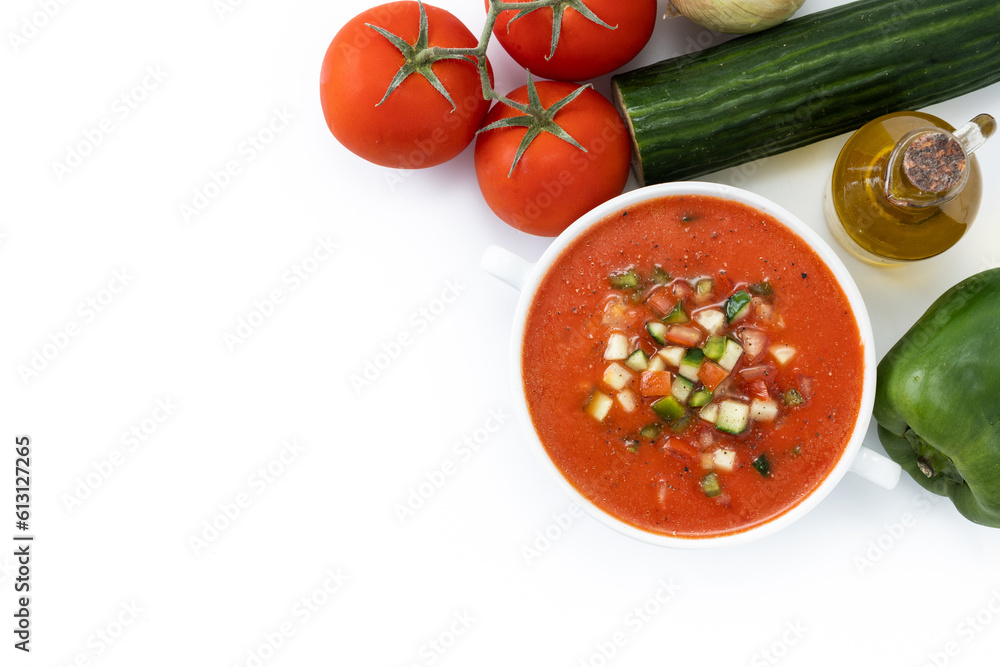 Traditional Spanish gazpacho soup in bowl with ingredients isolated on white background. Top view. Copy space Traditional Spanish gazpacho soup in bowl with ingredients isolated on white background. Top view. Copy space