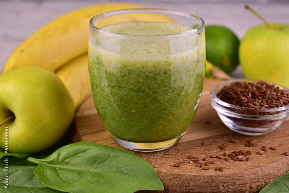 A glass of green healthy smoothie.Close-up.
A glass of green healthy smoothie.Close-up.