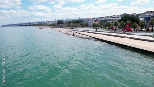 Aerial Drone Views of Ocean Waves Sweeping Across the Palm Beach