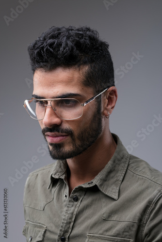 Attractive man in green shirt, metal glasses