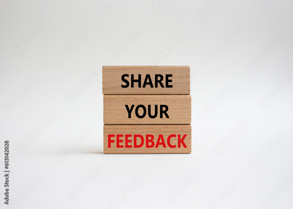 Naklejka premium Feedback symbol. Concept word Share your feedback on wooden blocks. Beautiful white background. Business and Ask for feedback concept. Copy space