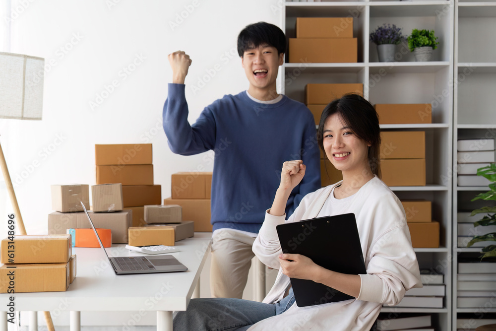Young Asian women couples are happy together after online selling things successfully. Attractive young Asian couples online shopping while working from home on laptop Young Asian women couples are happy together after online selling things successfully. Attractive young Asian couples online shopping while working from home on laptop
