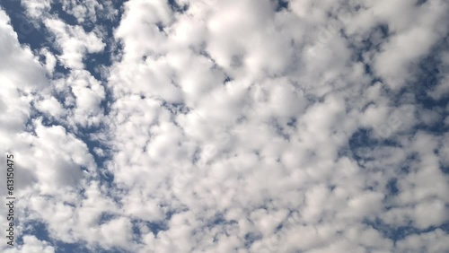 Compact fluffy stratocumulus clouds in the sky in the morning photo