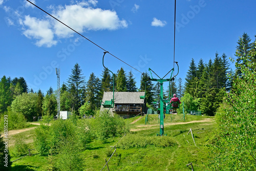  Chairlift ride in summer sunny day, Tobolow peak, Koninki, Gorce mountains.