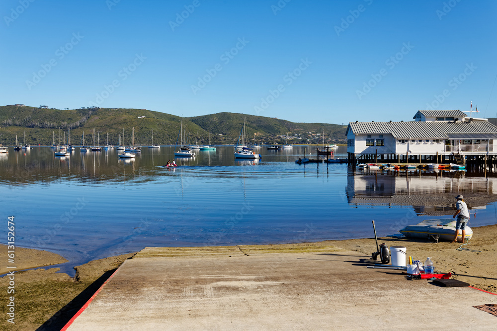 A view over the Knysna lagoon during a perfectly calm moment, showing beautiful reflections off the surface.