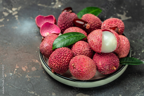 lychees, Ripe lychee. Exotic asian fruits on a dark background, Long banner format. top view