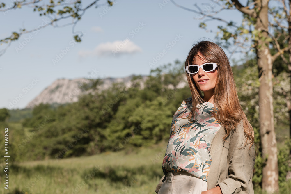 cheerful and playful woman with sunglasses outdoors cheerful and playful woman with sunglasses outdoors